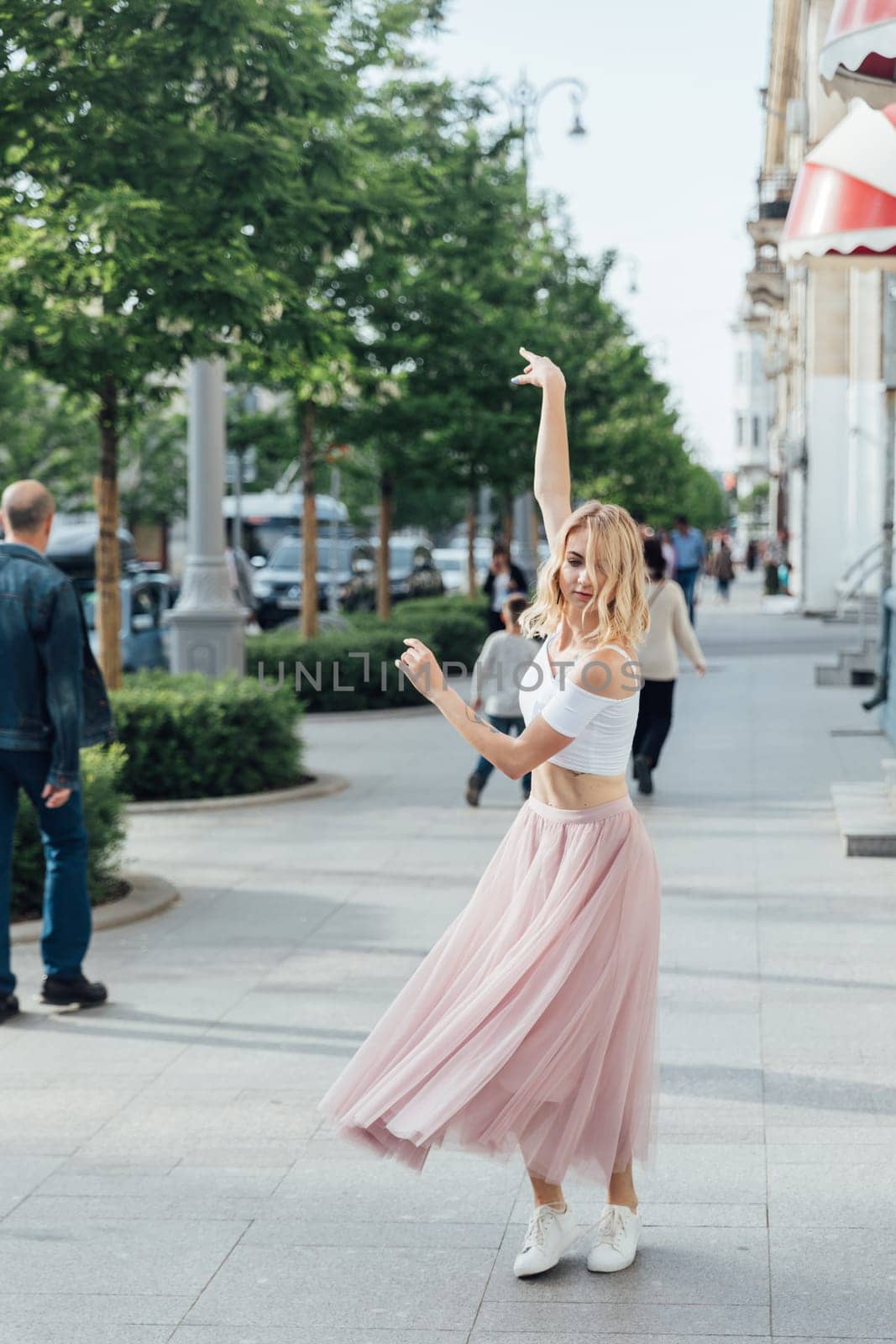 blonde dancing on the street