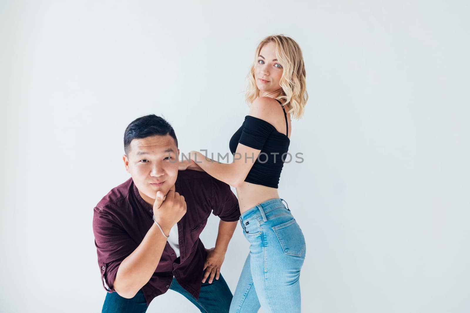 Man and woman lovers posing on white background by Simakov