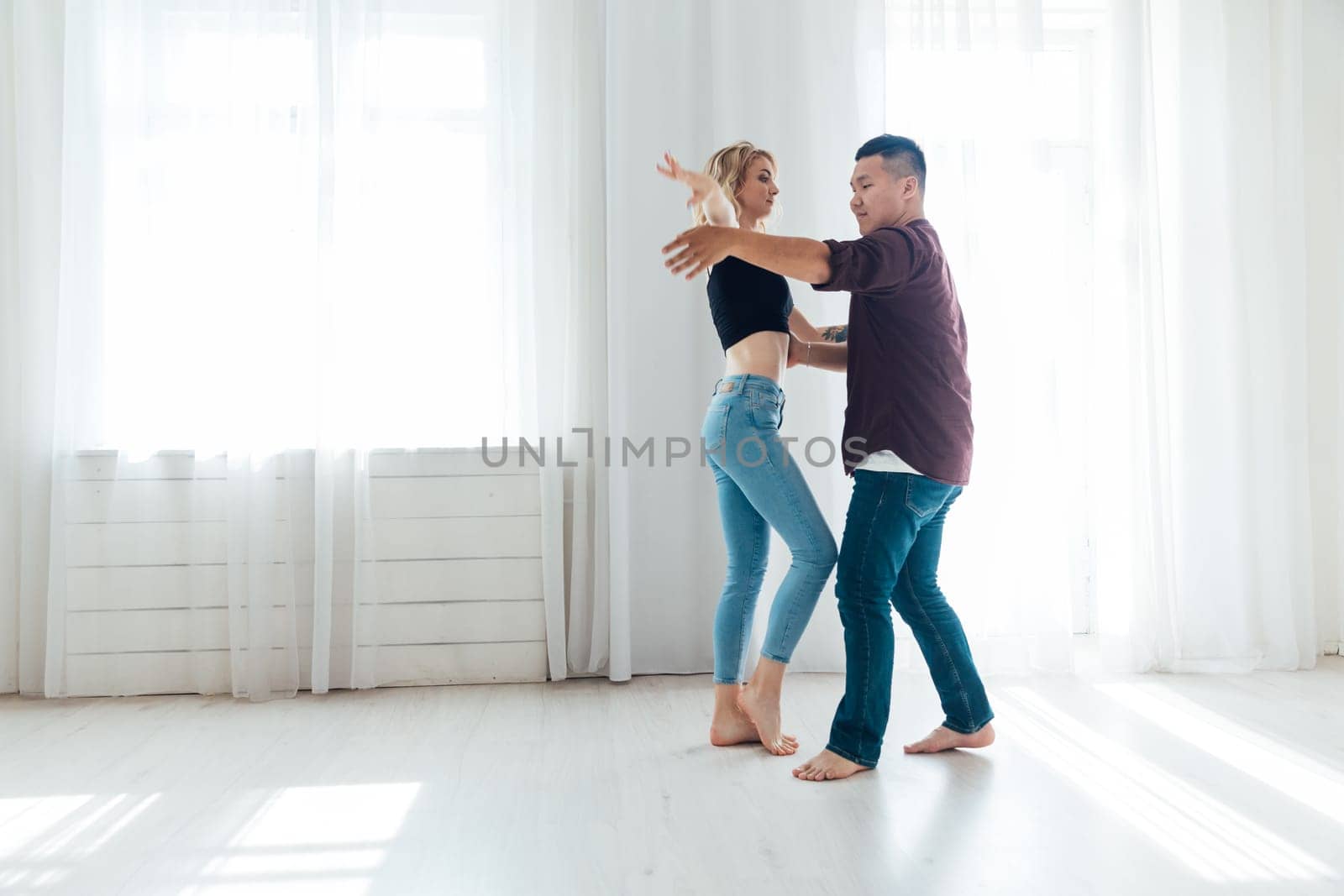 Dancing man and woman in the dance hall of the studio show