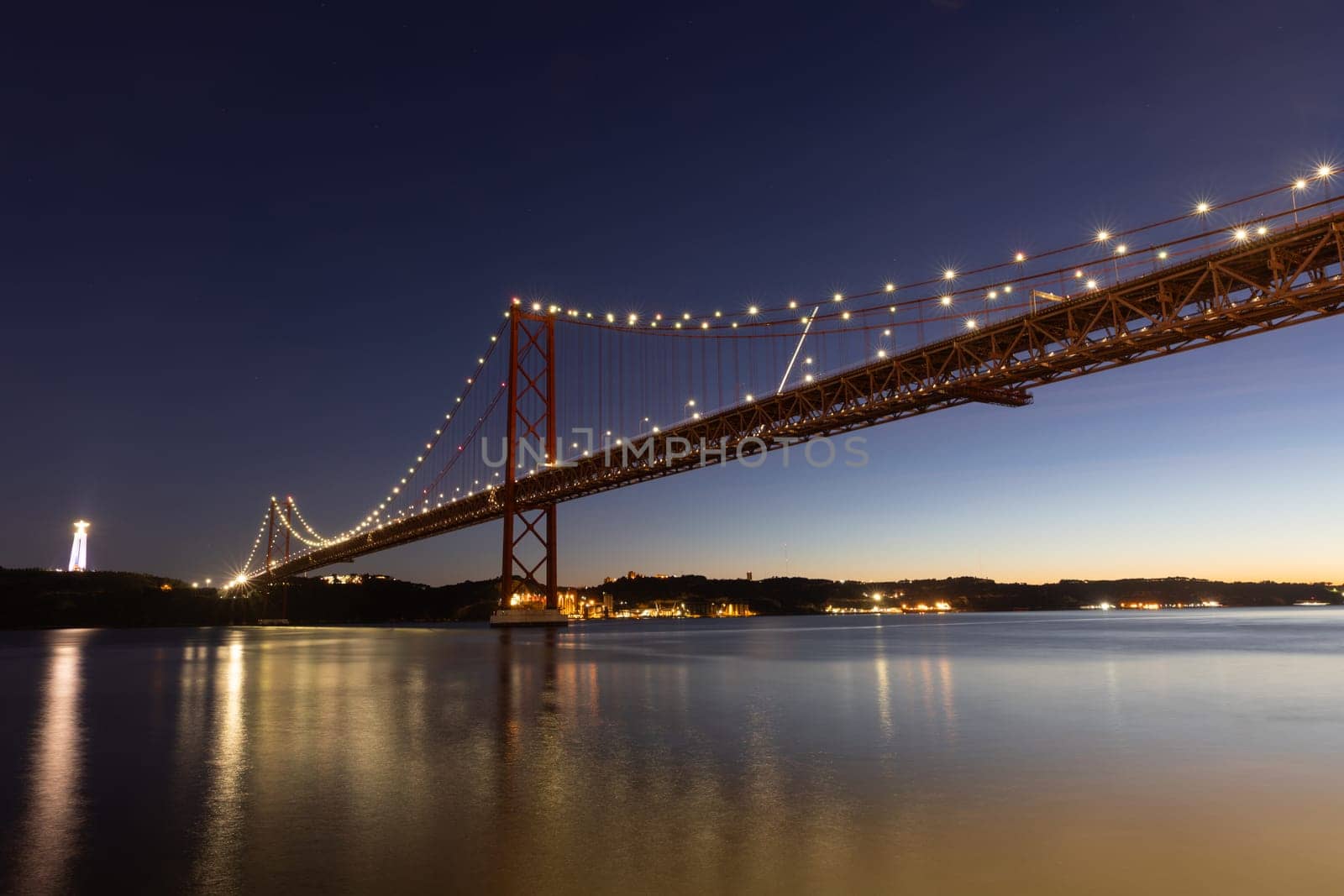 25 april bridge in Lisbon, Portugal at dusk - wide angle