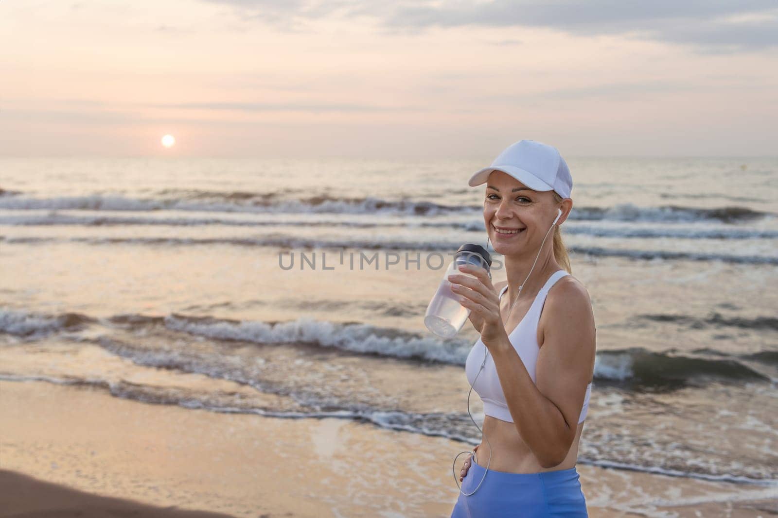 a girl of European appearance in sportswear stands outdoors, portrait of a girl in sportswear. High quality photo