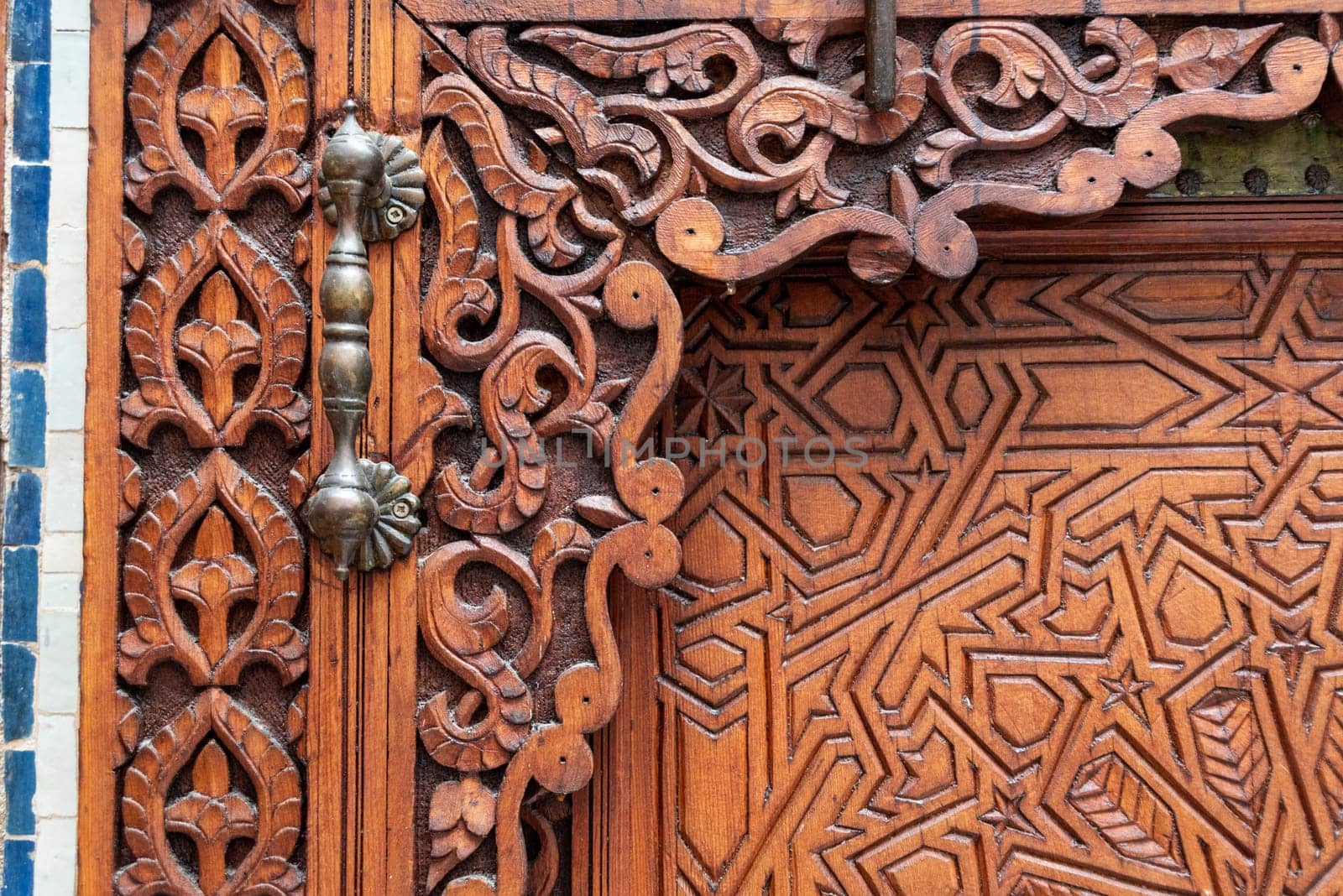 Rich decorated door in an Arab palace in Marrakech, Morocco