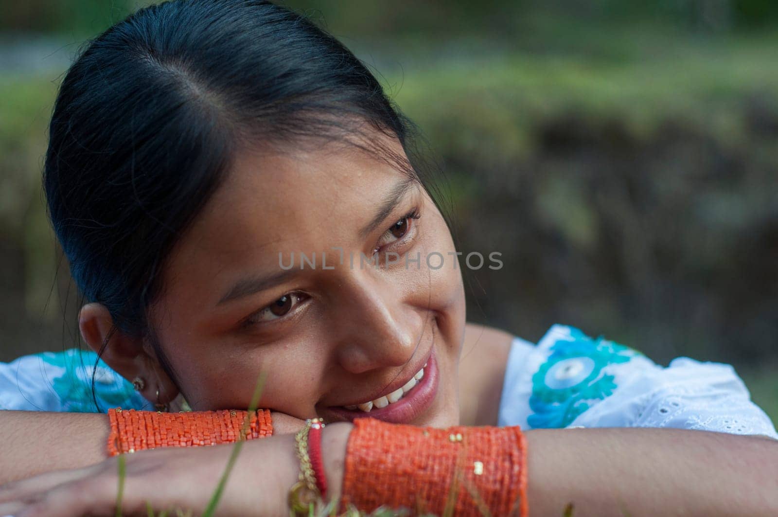 smile day indigenous girl from latin america enjoying her surroundings in traditional dress from ecuador. High quality photo