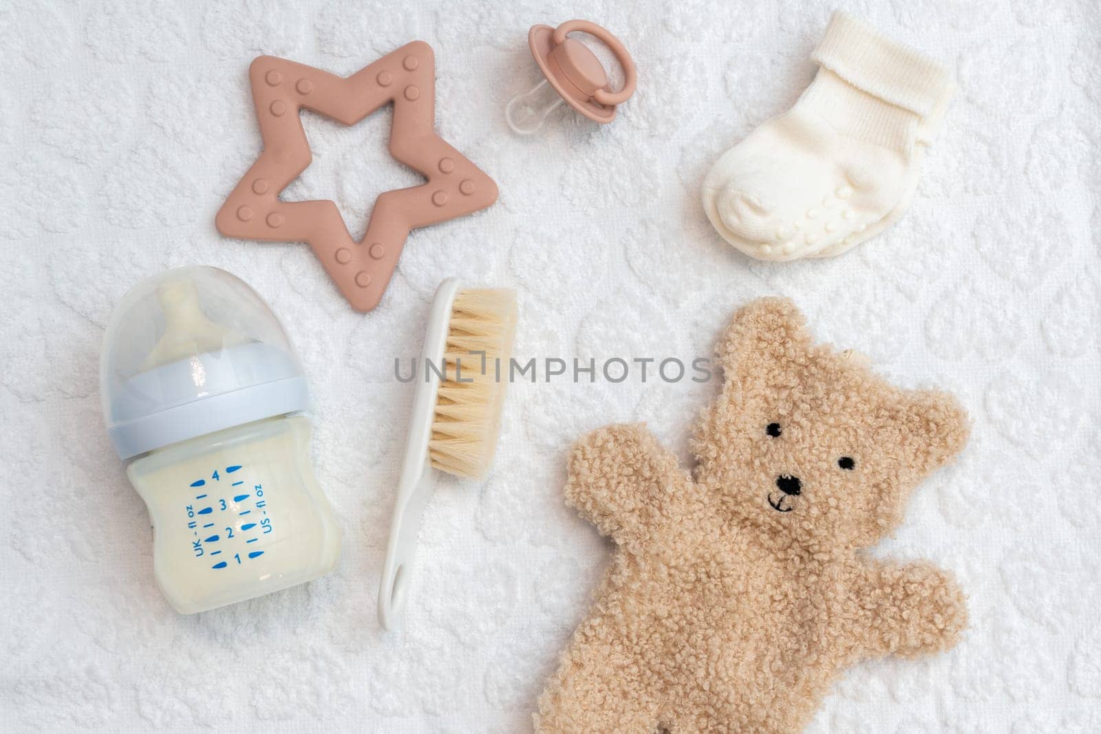 Glimpse into a well-curated collection of newborn accessories, captured in top view, emphasizing