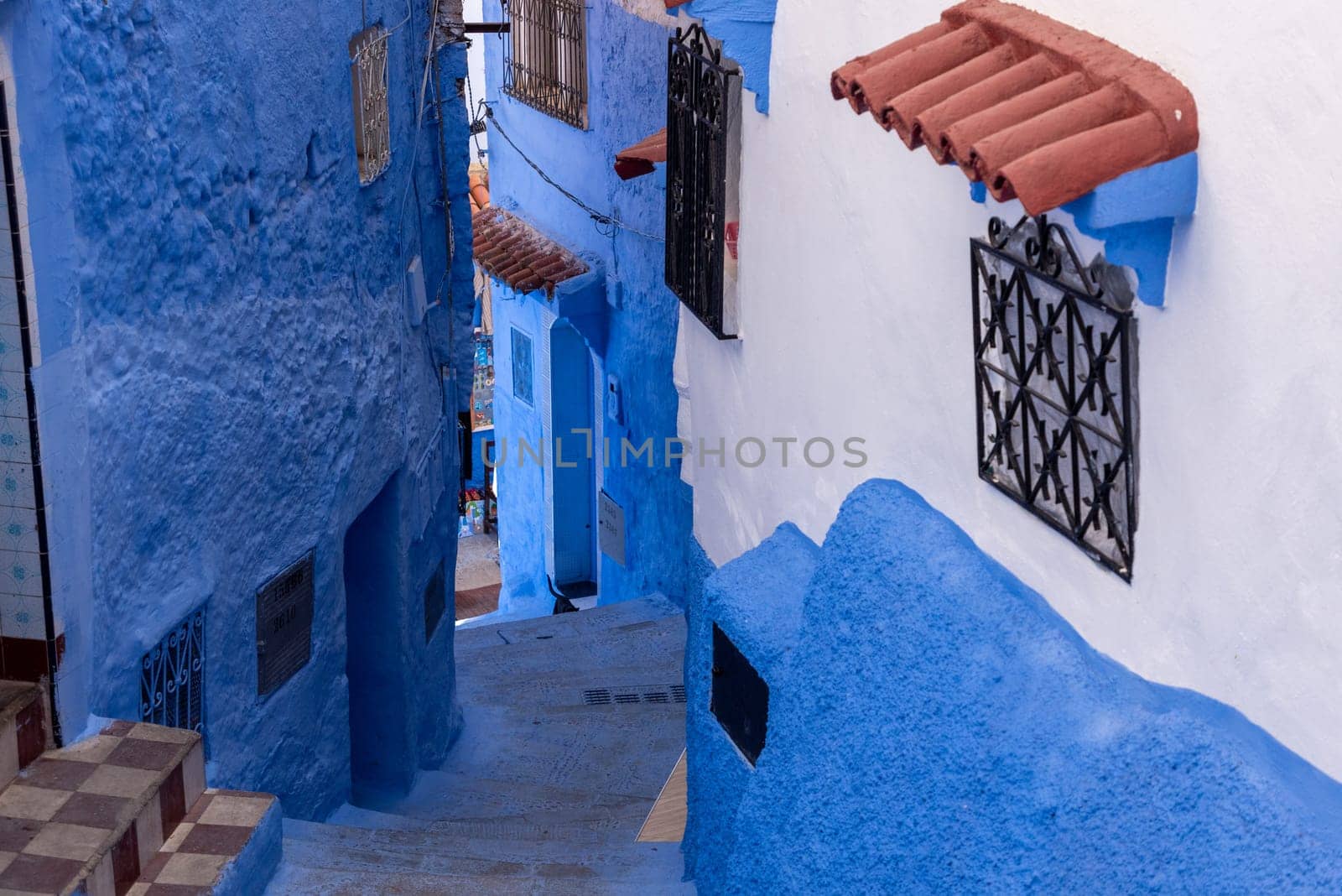 Vibrant blue colored alley in downtown Chefchaouen, Morocco