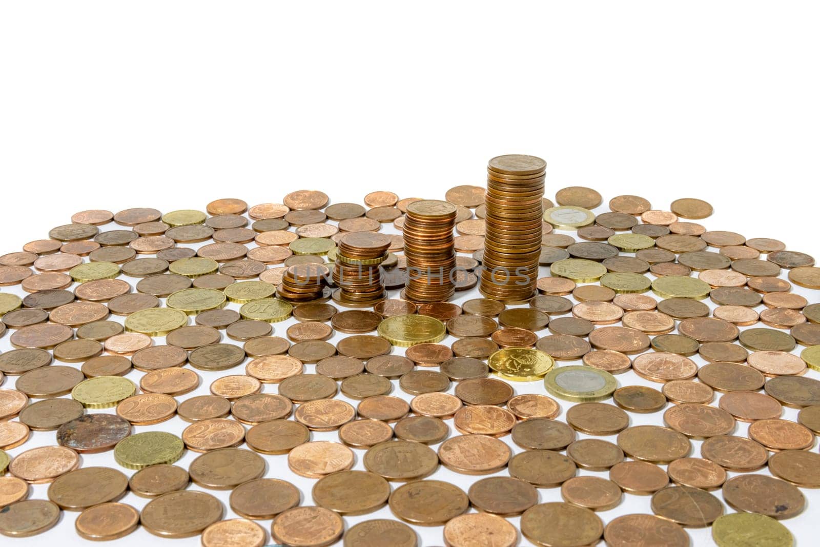 Stacks of gold coins. Gold coins on a white background. Money on a white background. Copy space. Treasure hunt. The chalk was erased on the board. Board background. High quality photo