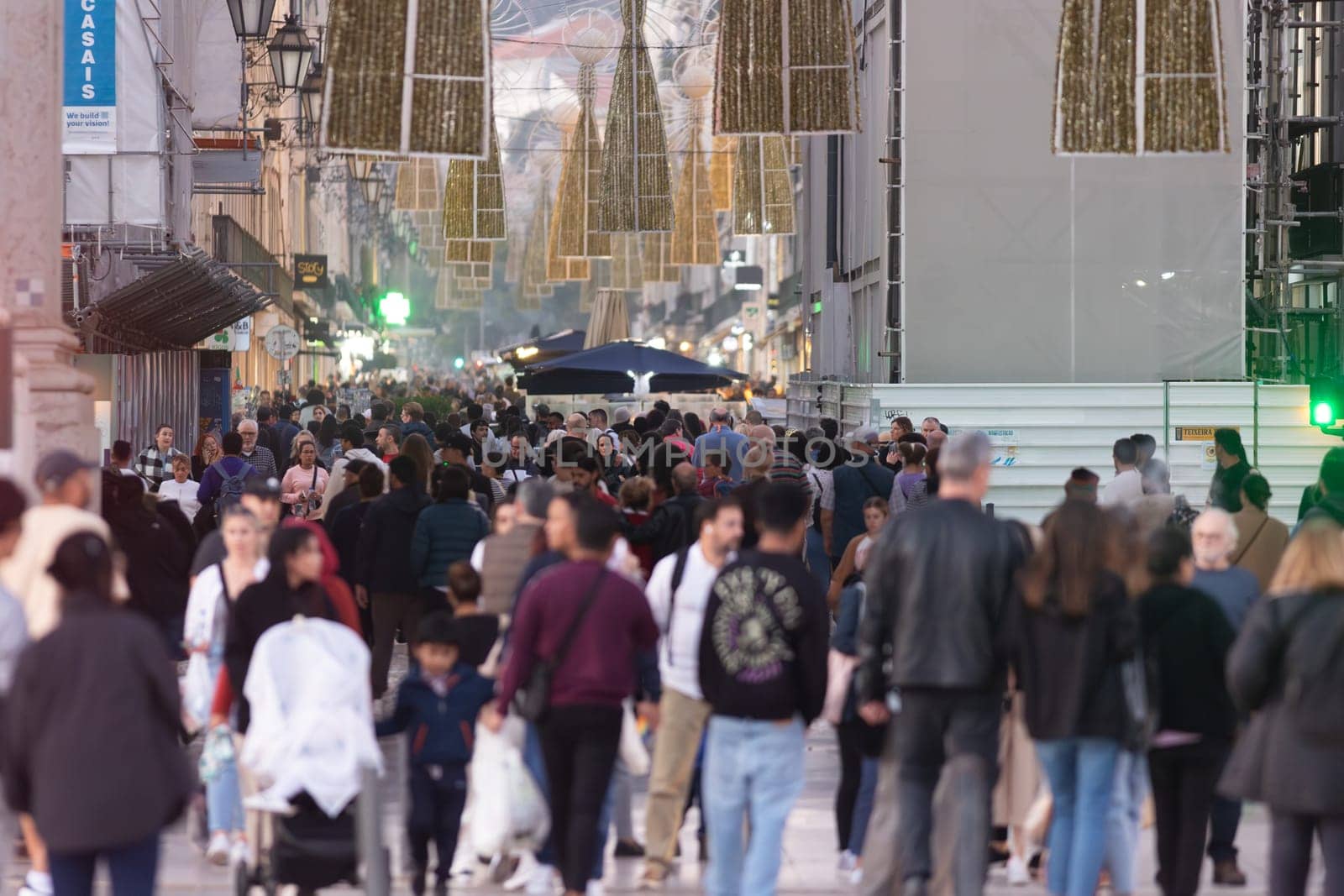 14 november 2023, Lisbon, Portugal - crowd of people walking down a street Rua Agusta near Commercio plaza by Studia72