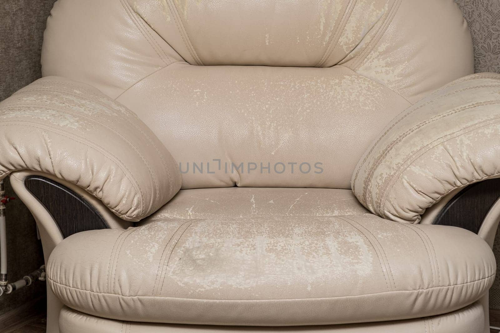 Defects on a white leather sofa. Damaged to leather furniture. by AnatoliiFoto