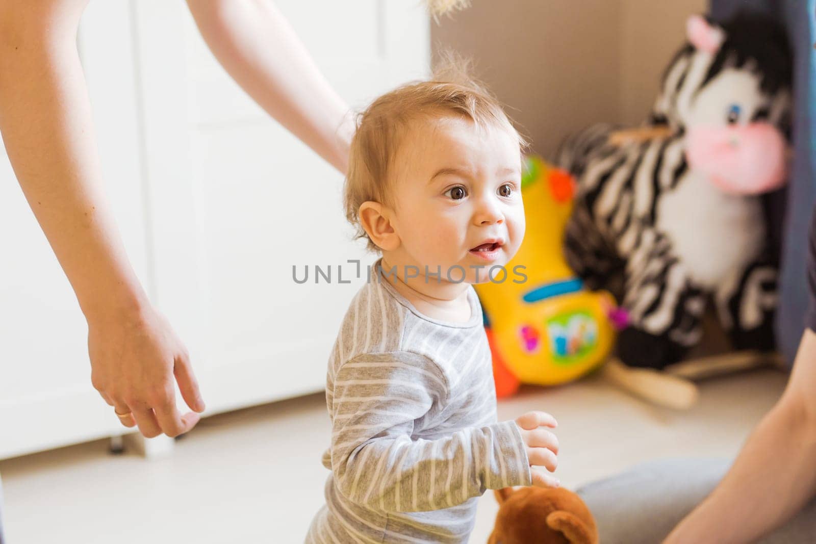 Excited Young Baby Boy in the bedroom