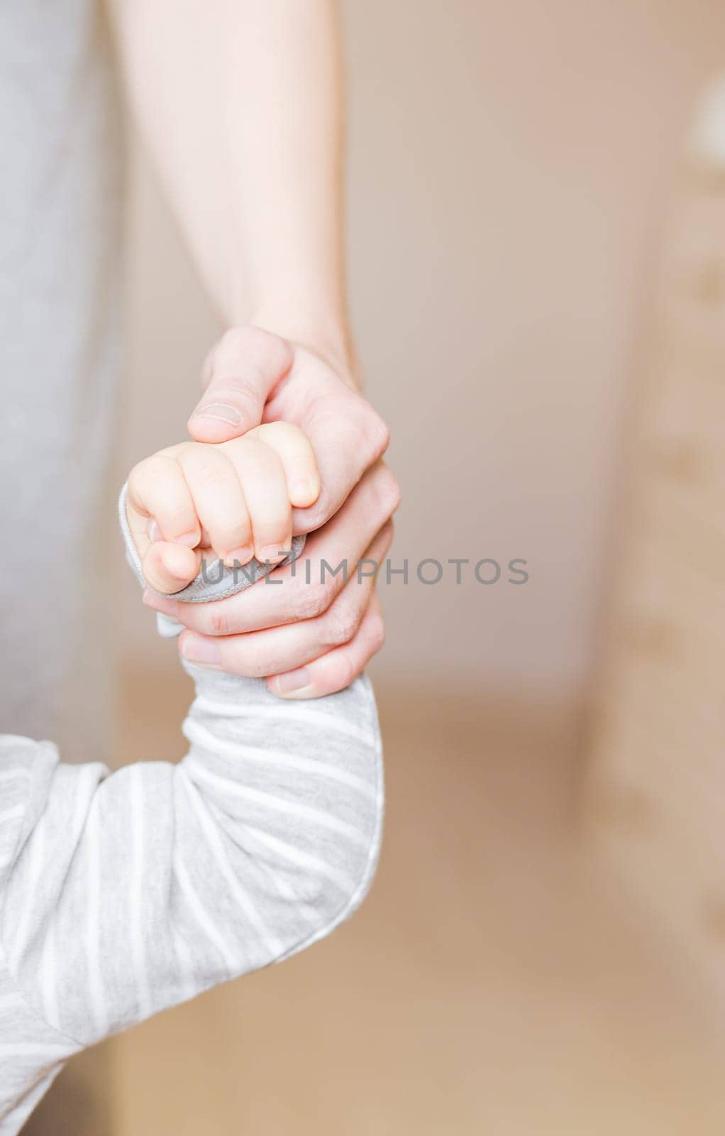 Concept of love and family. hands of mother and baby closeup.