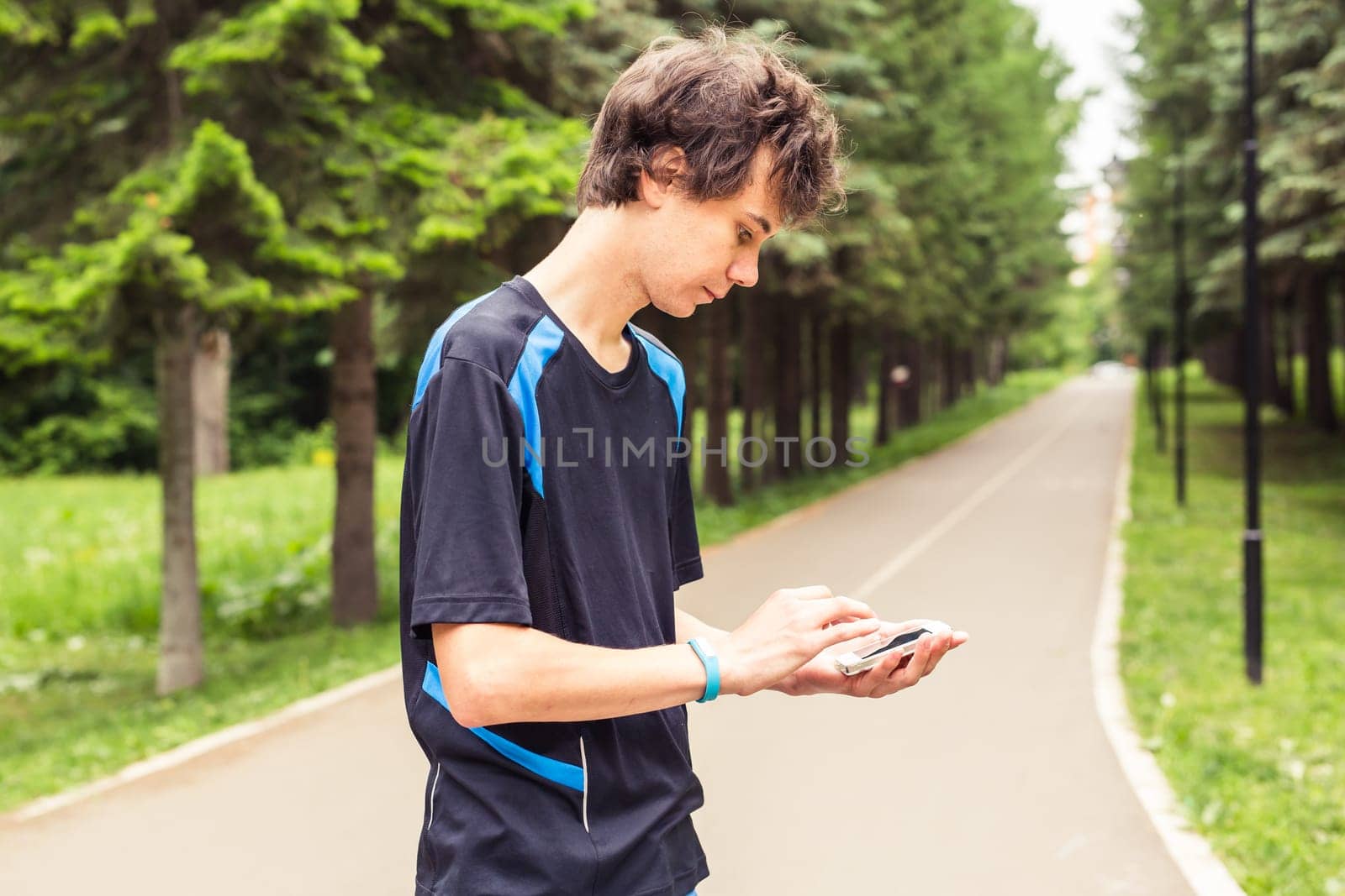 Man checking fitness and health tracking wearable device.