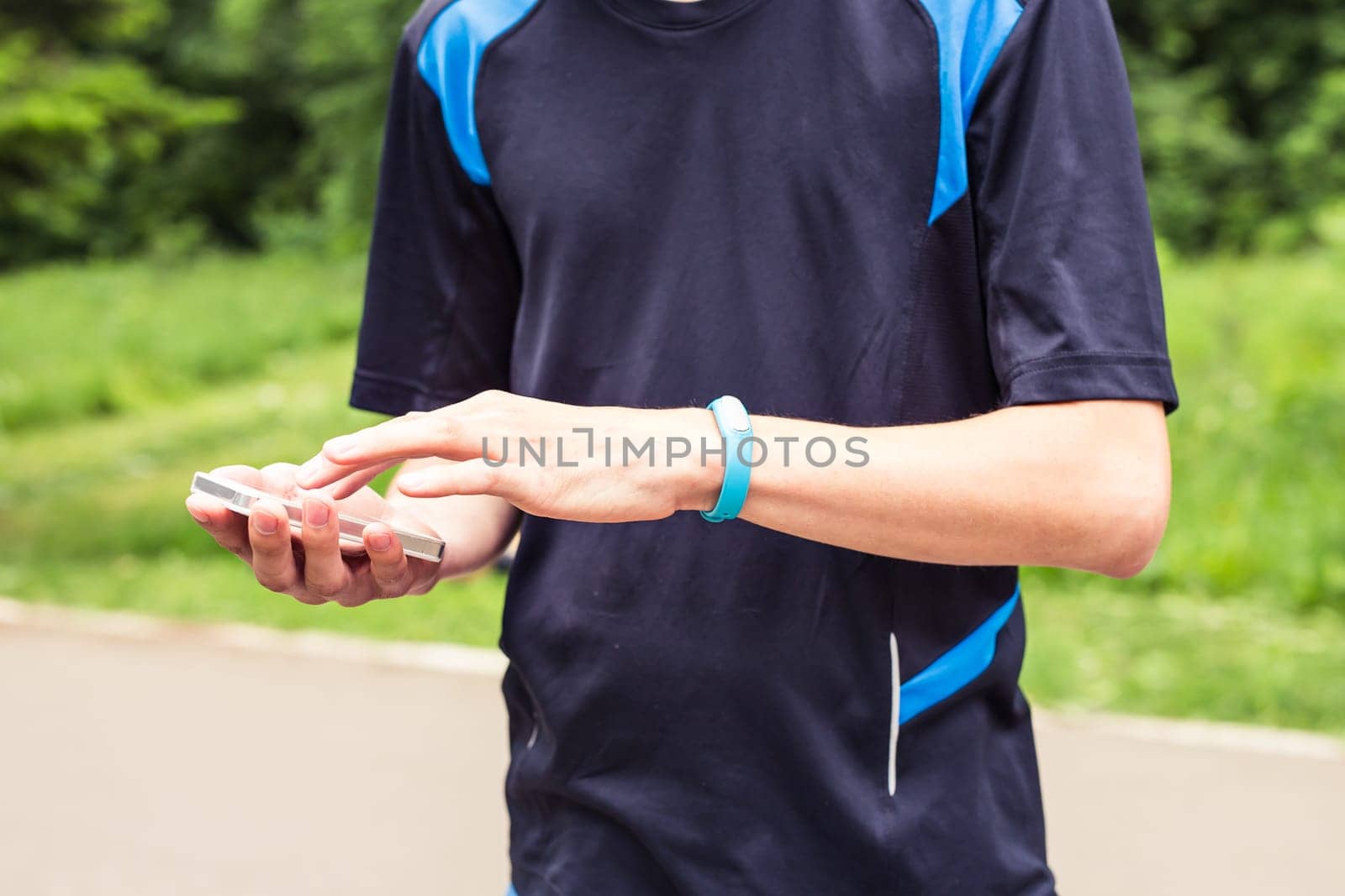 Hand wearing a fitness tracking armband by Satura86