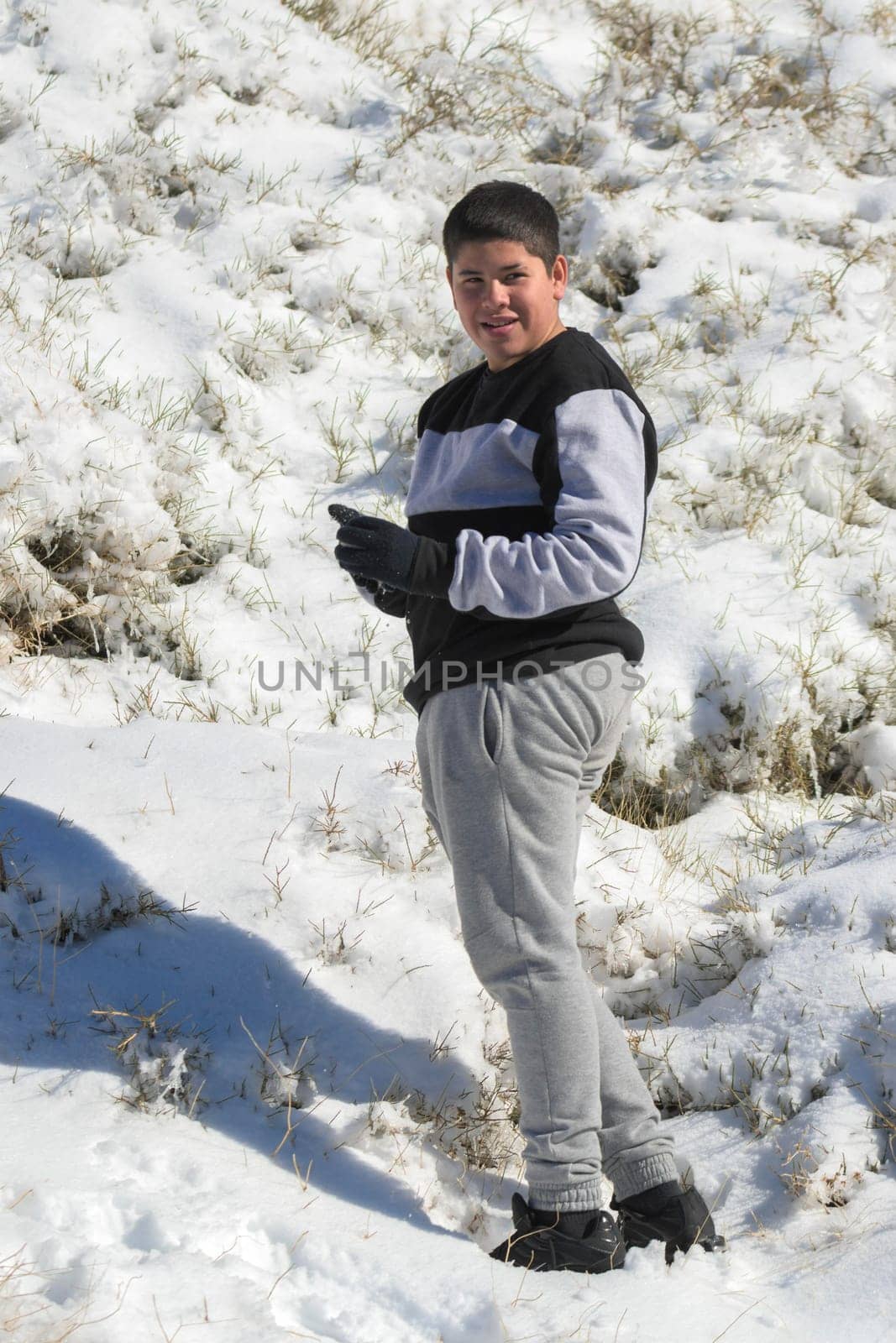 young latin guy in sportswear in the snow,ski resort by carlosviv