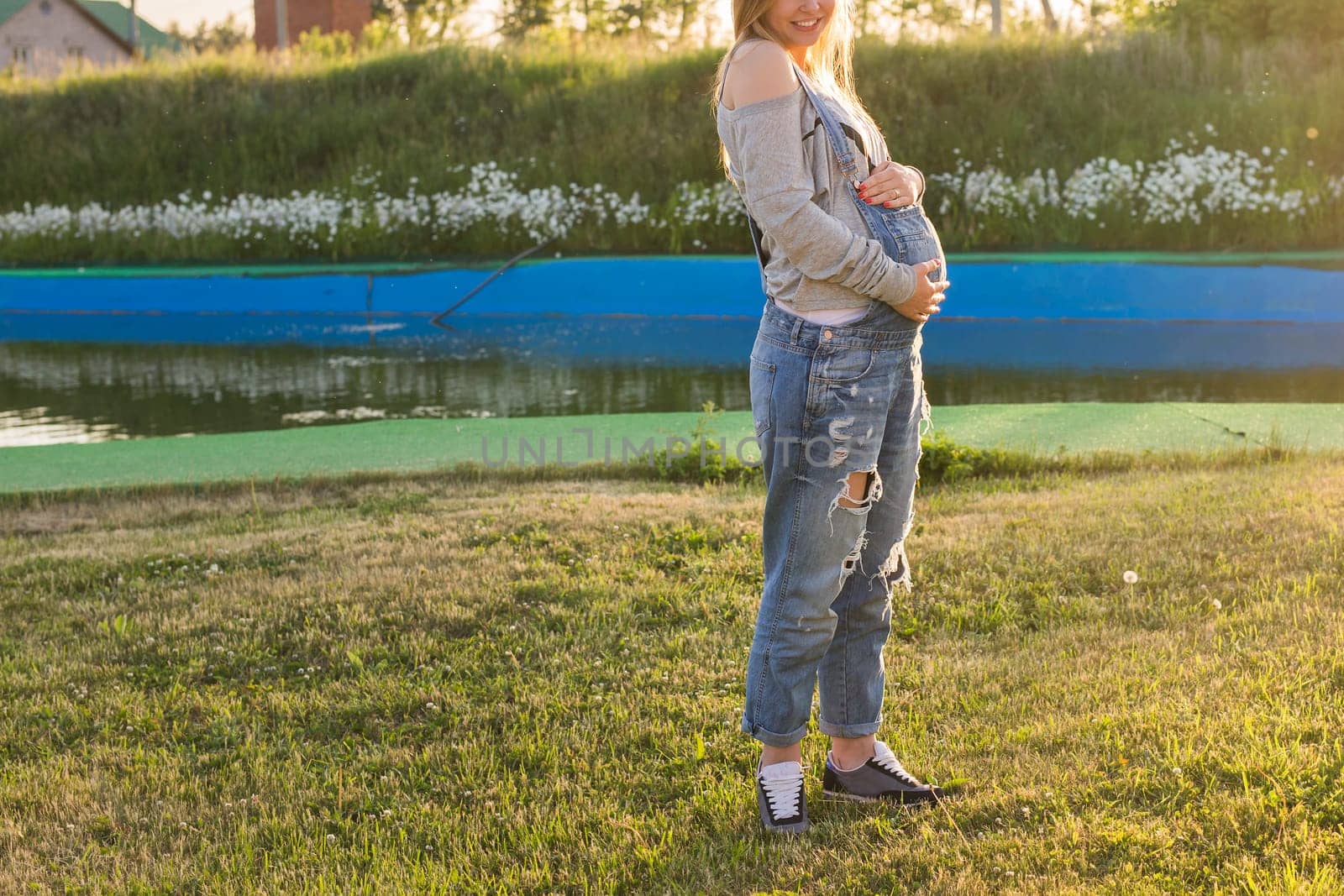 young happy pregnant woman relaxing and enjoying life in autumn nature by Satura86