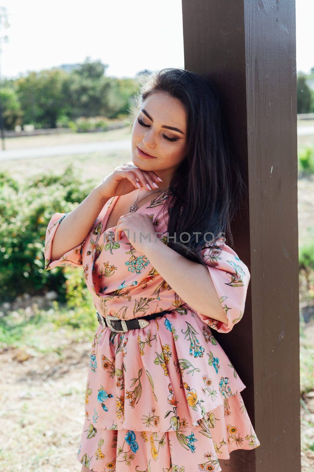 Beautiful brunette woman for a walk in the park by Simakov