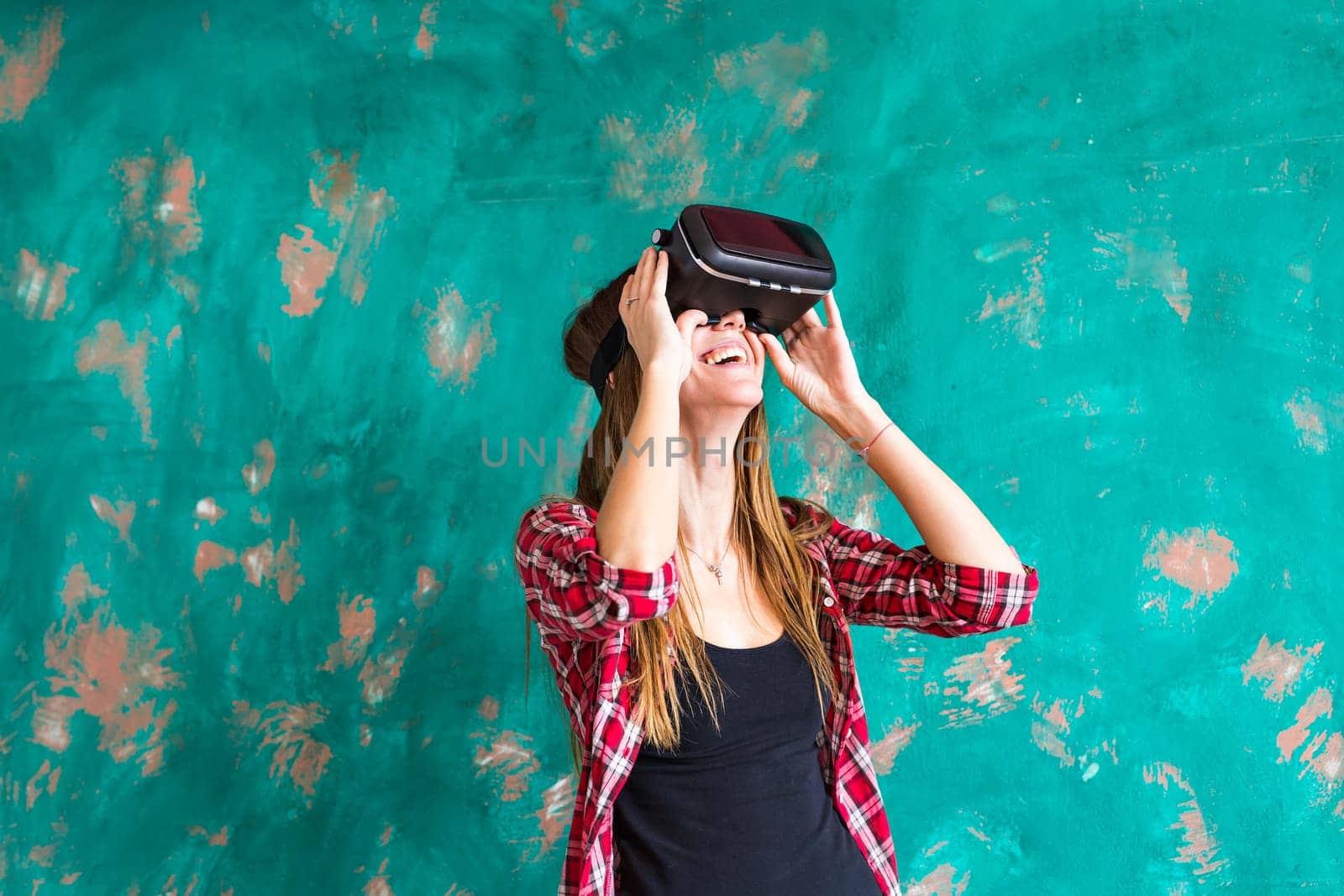 Woman in virtual reality headset enjoying her experience.