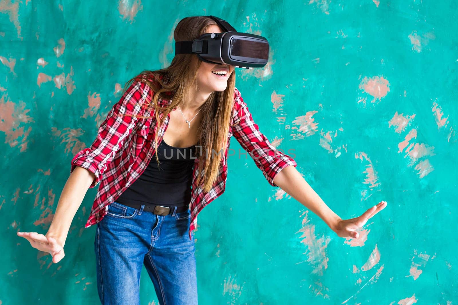 Young Woman feeling shocking for using the virtual reality device.