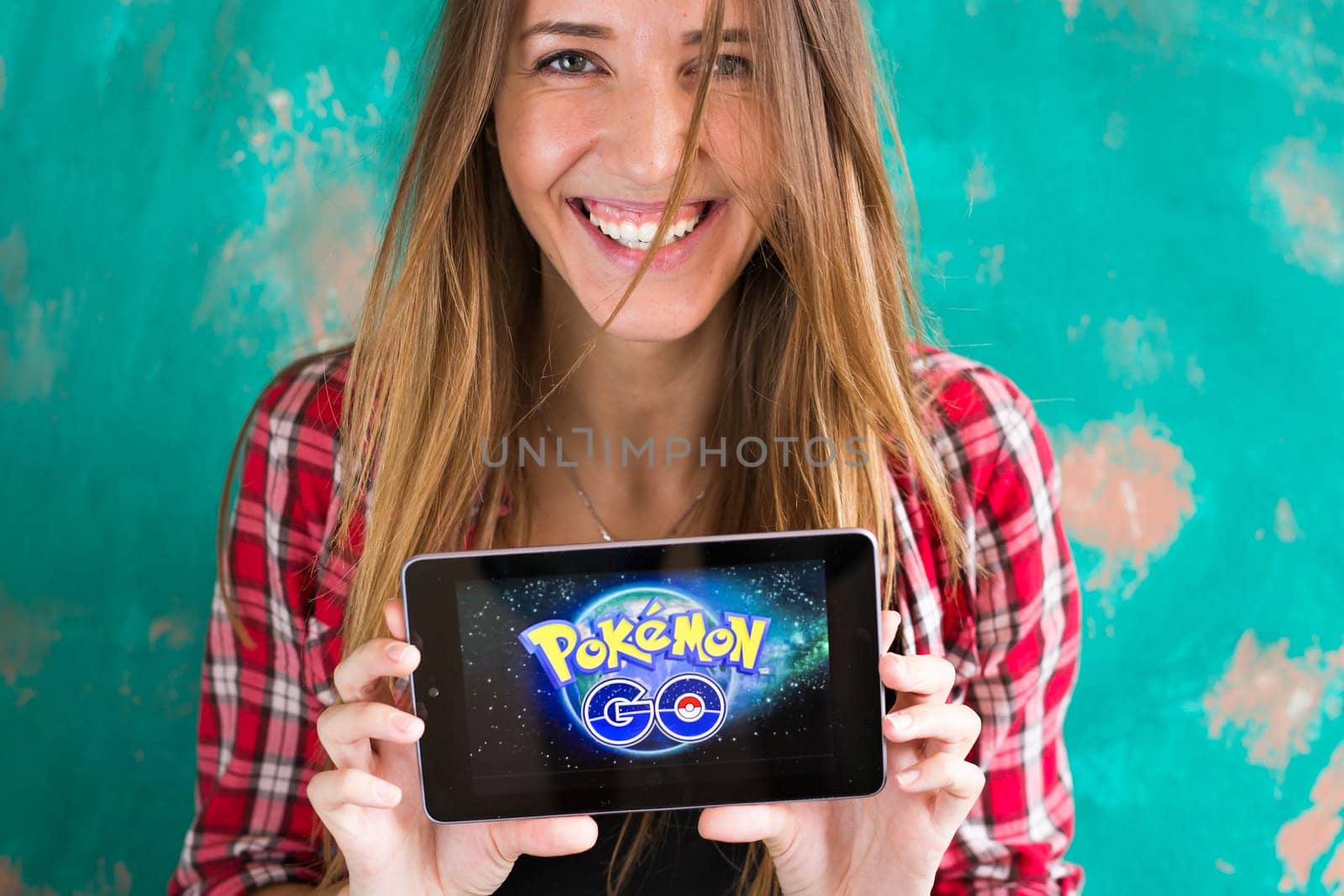 Ufa, Russia. - July 29: Woman show the tablet with Pokemon Go logo, July 29, 2016 in Ufa, Russia by Satura86