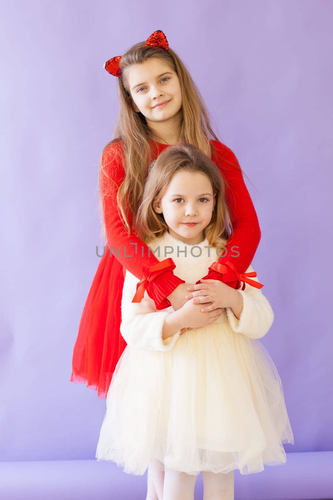 Two girls in red and white sister dresses by Simakov