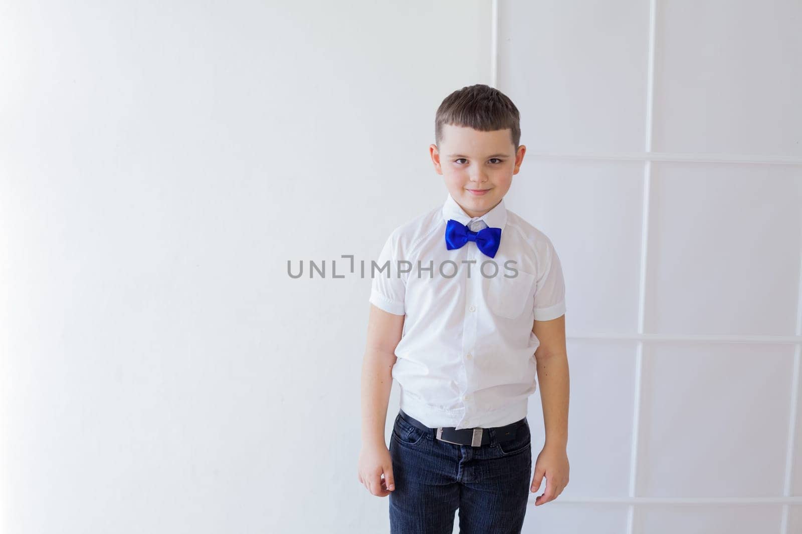 portrait of a boy with a butterfly on a white background