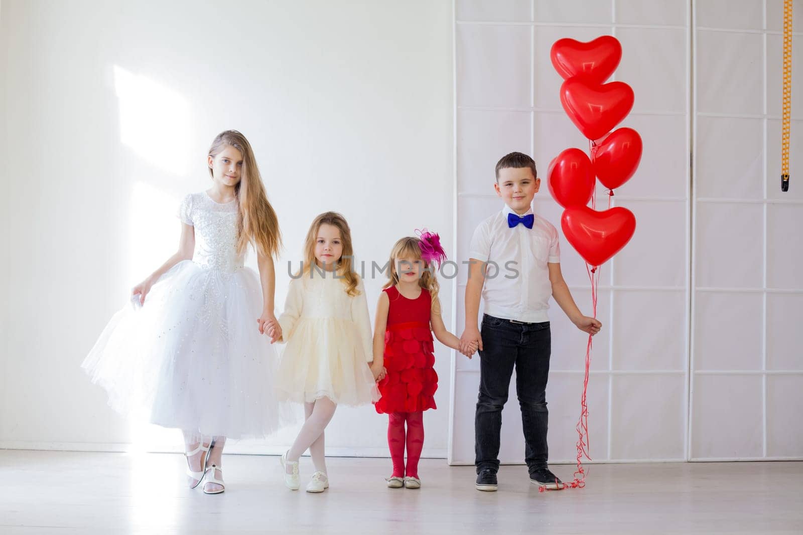 beautiful children with red heart balloons nice by Simakov