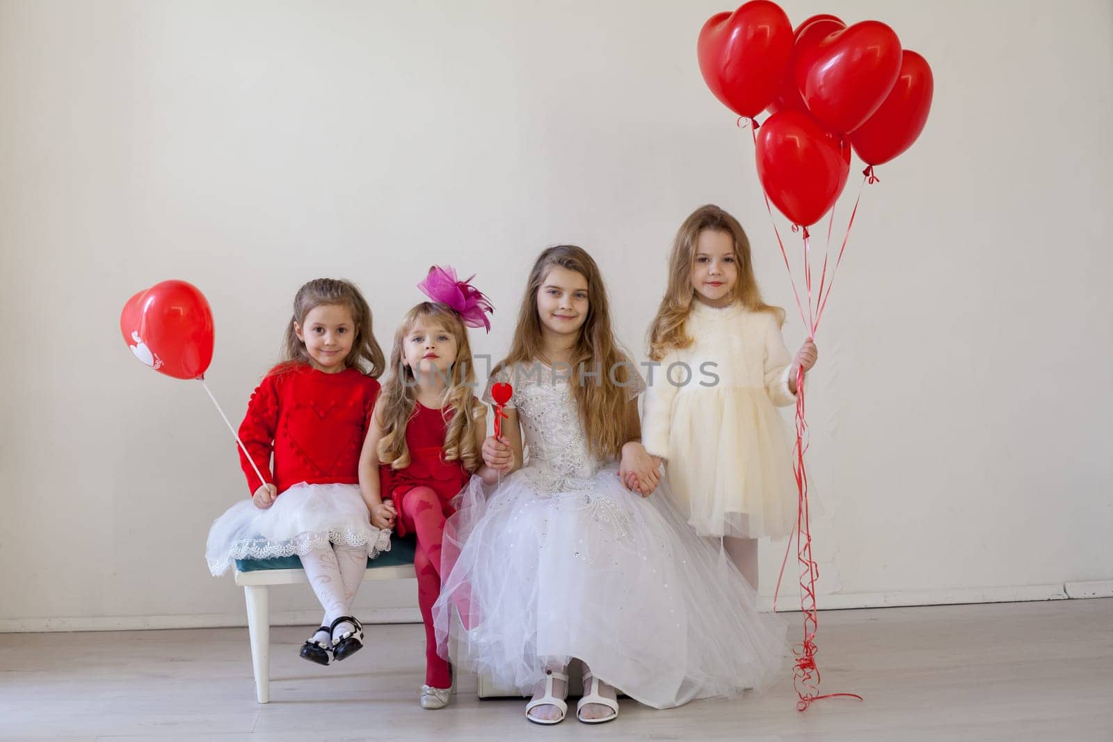 Kids boy and girls with red balloons by Simakov