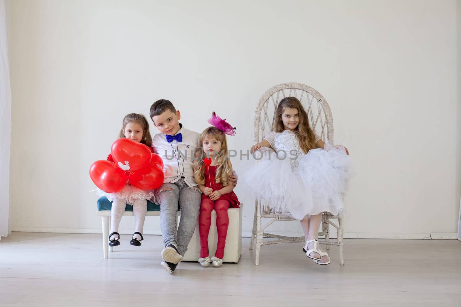 Kids boy and girls with red balloons by Simakov