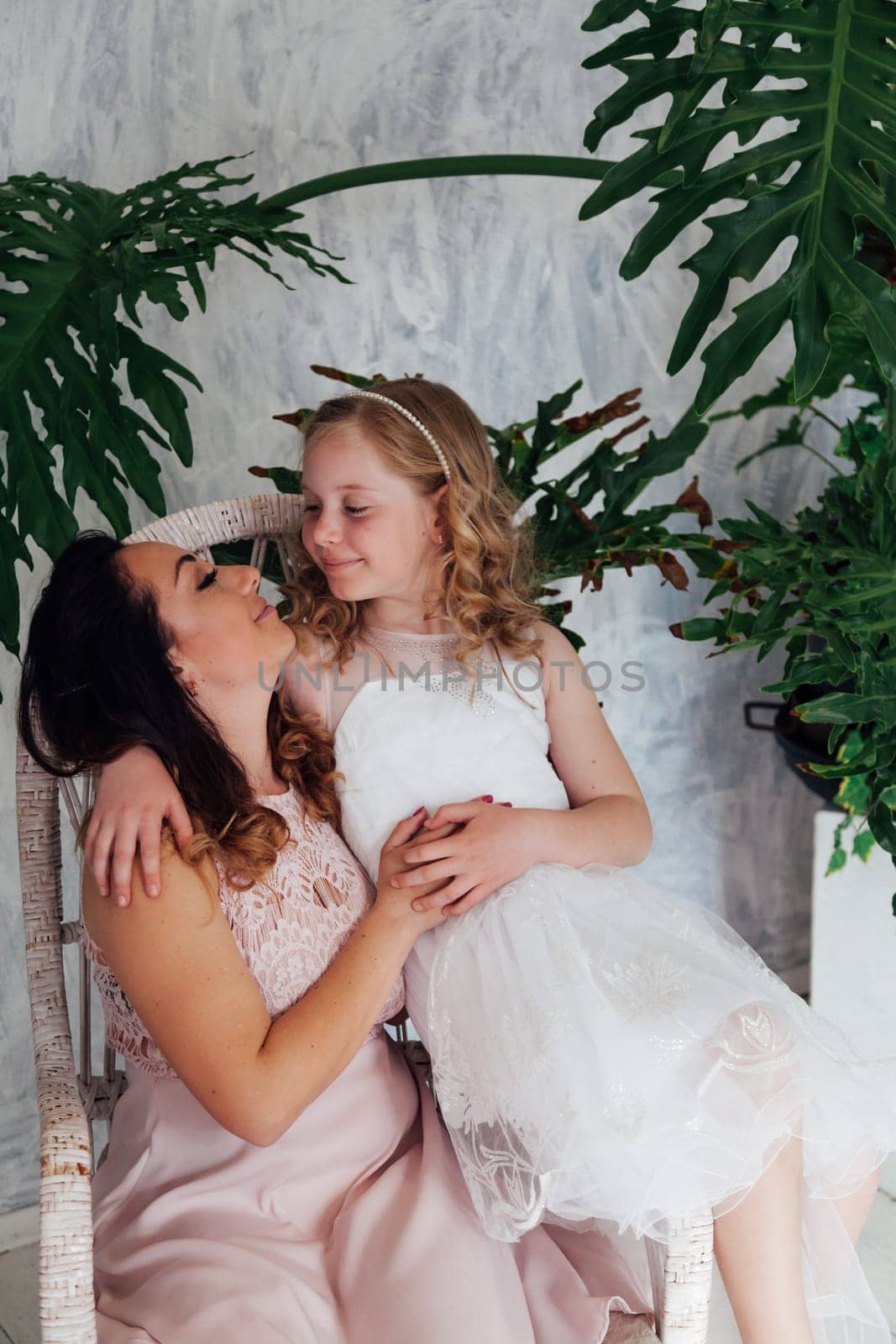 Mom and daughter portrait on background