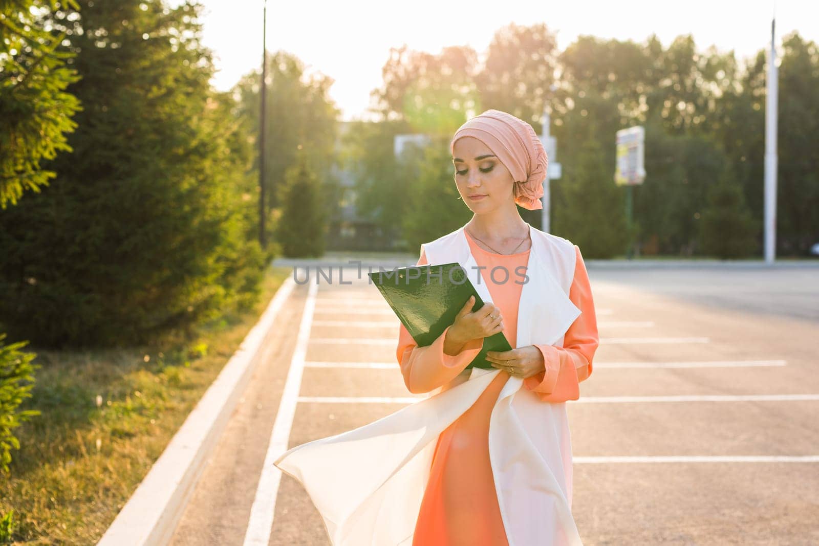 Muslim woman holding document paper by Satura86