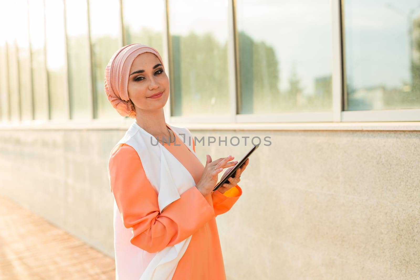 beautiful arabian girl with tablet computer. Muslim woman. by Satura86