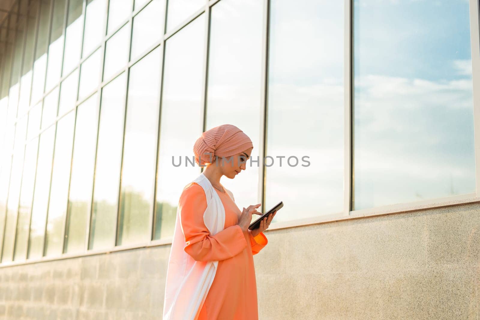 beautiful arabian girl with tablet computer. Muslim woman