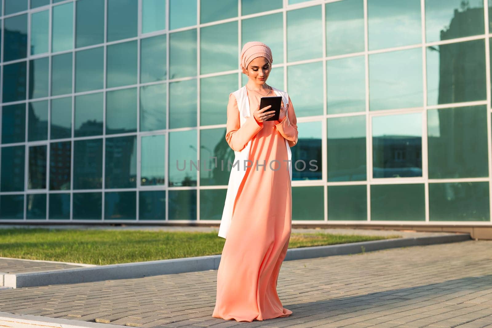 beautiful arabian girl with tablet computer. Muslim woman. by Satura86