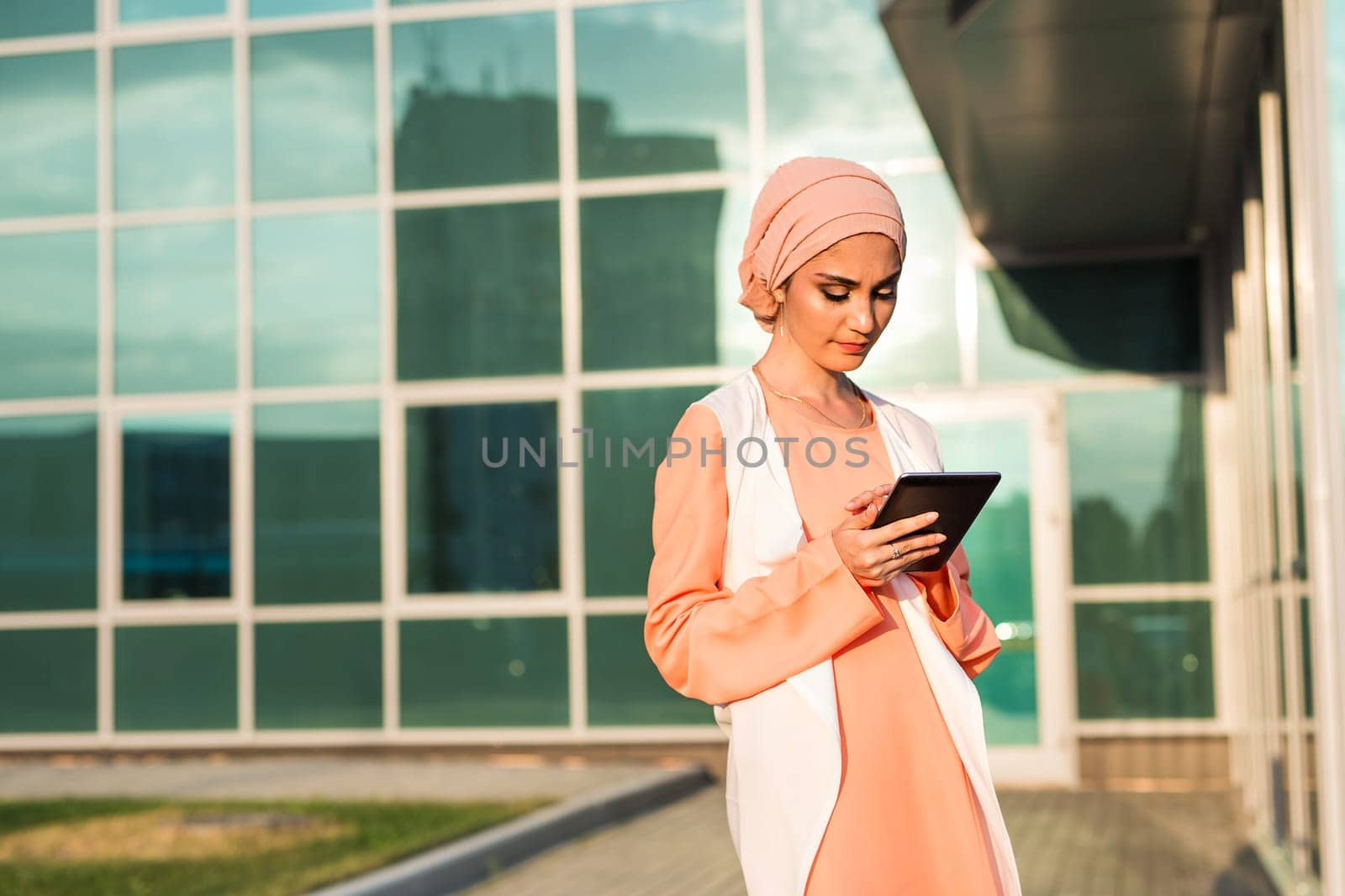 beautiful arabian girl with tablet computer. Muslim woman