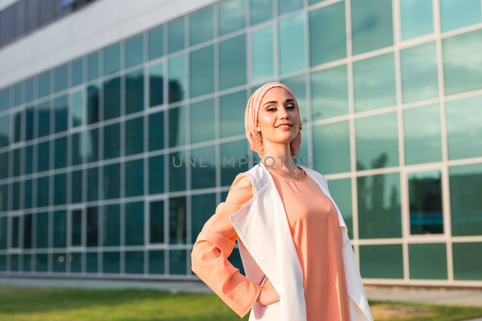 girl in abaya on the background of the business center.