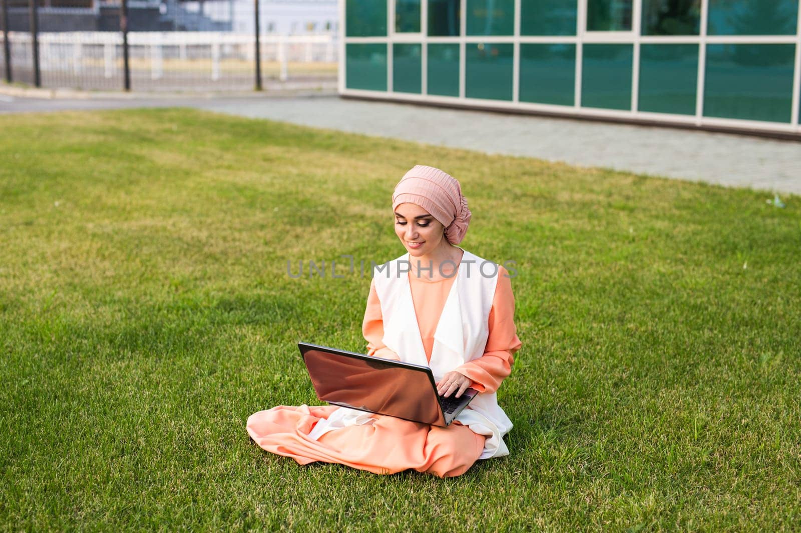 Young Muslim Girl using laptop by Satura86