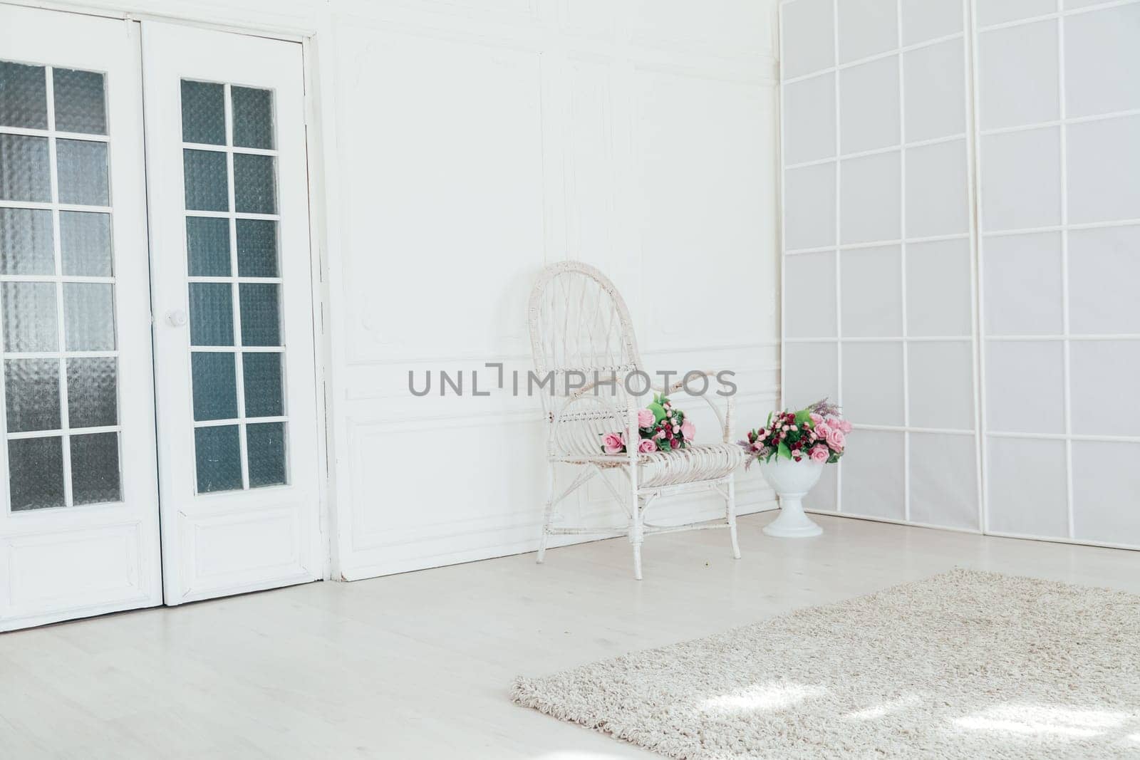 chair in the interior of the white room decor of the house by Simakov