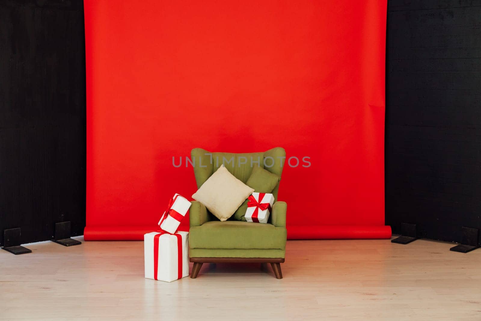 Red black background chair with gifts for Christmas birthday party by Simakov