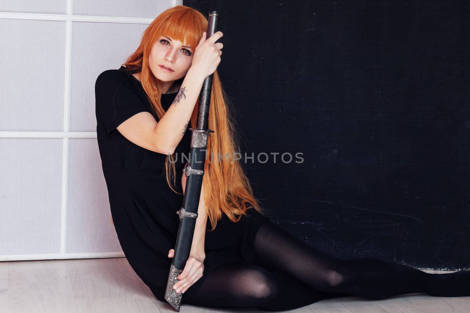 young woman in japanese anime cosplay, holding samurai sword. by Simakov