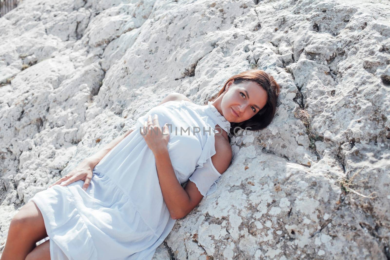 beautiful woman with long hair portrait of a cliff by Simakov