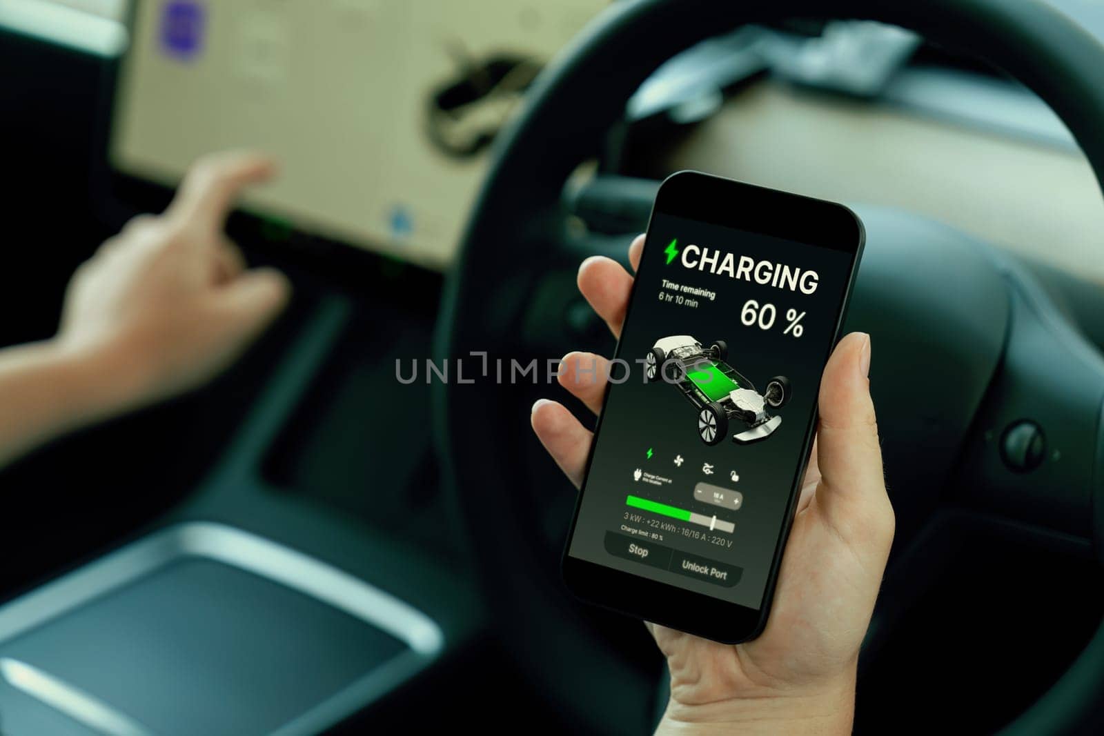 Holiday vacation road trip with environmental-friendly car concept. Eco-conscious woman on driver seat checking EV car's battery status display on smartphone during car travel. Perpetual