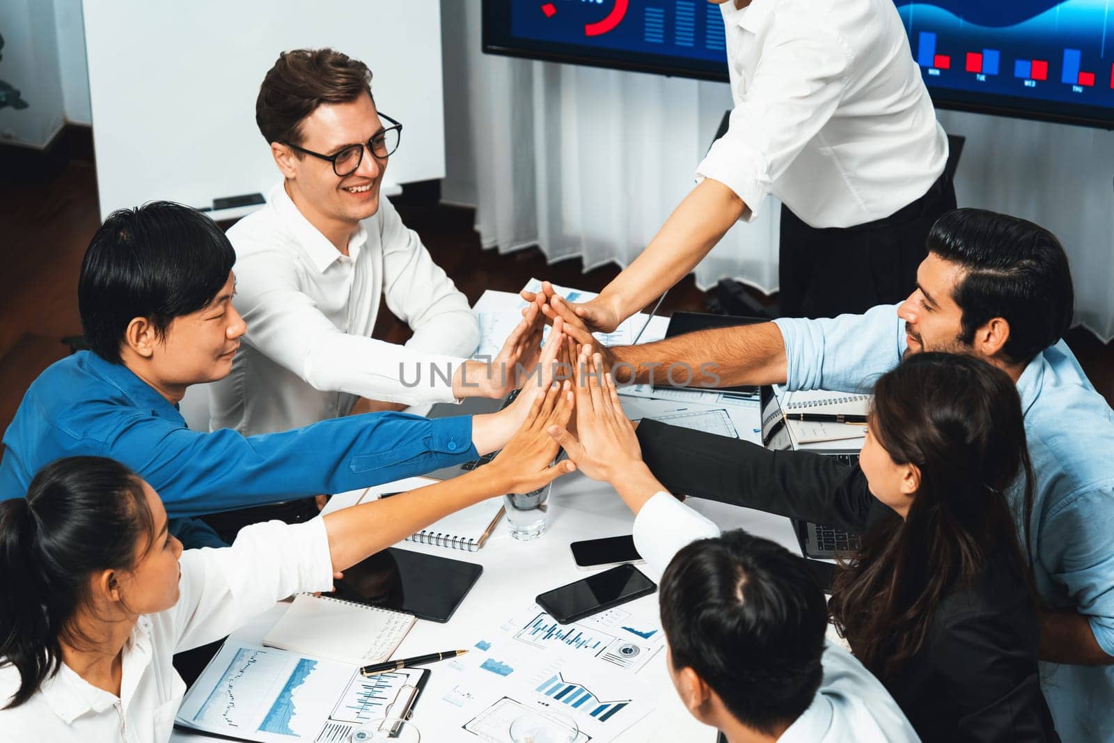 Group of diverse office worker employee high five and working together. Prudent by biancoblue