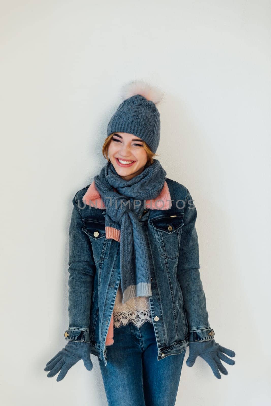 Beautiful woman in winter clothes and knitted hat by Simakov