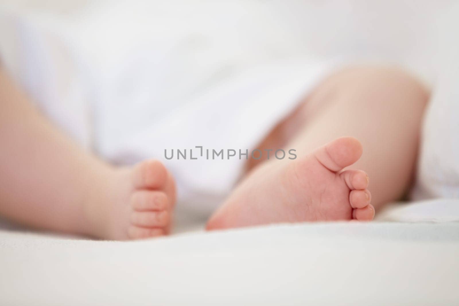 Sleeping, bed and feet of baby in home for dreaming, resting and nap for child development. Family, nursery and closeup of toes of newborn infant in bedroom relax for wellness, health and growth.