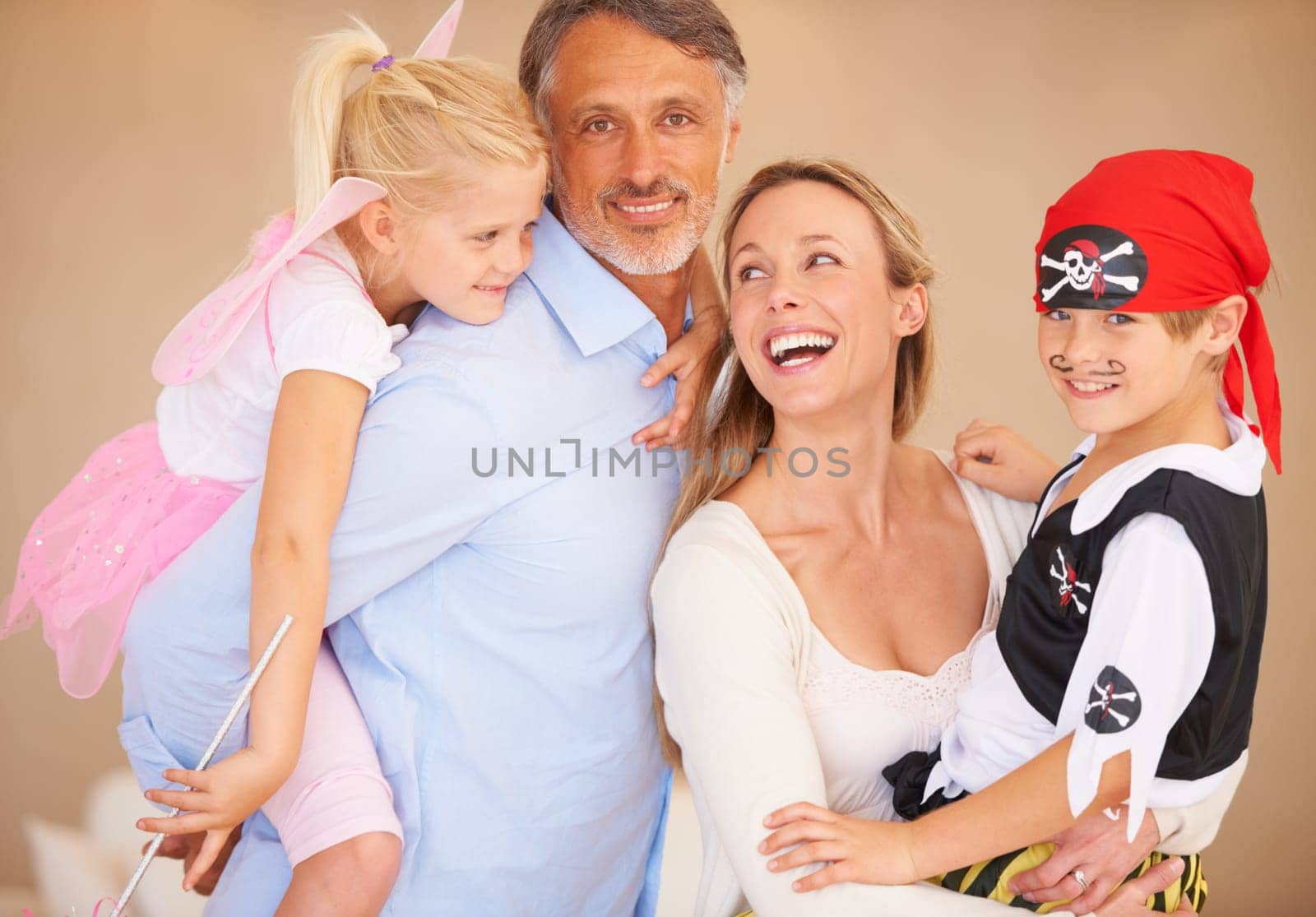 Father, son or portrait for halloween with happy family, bonding or happiness in childhood. Man, boy and face with smile for event with fairy and pirate costumes, love and party celebration in house.