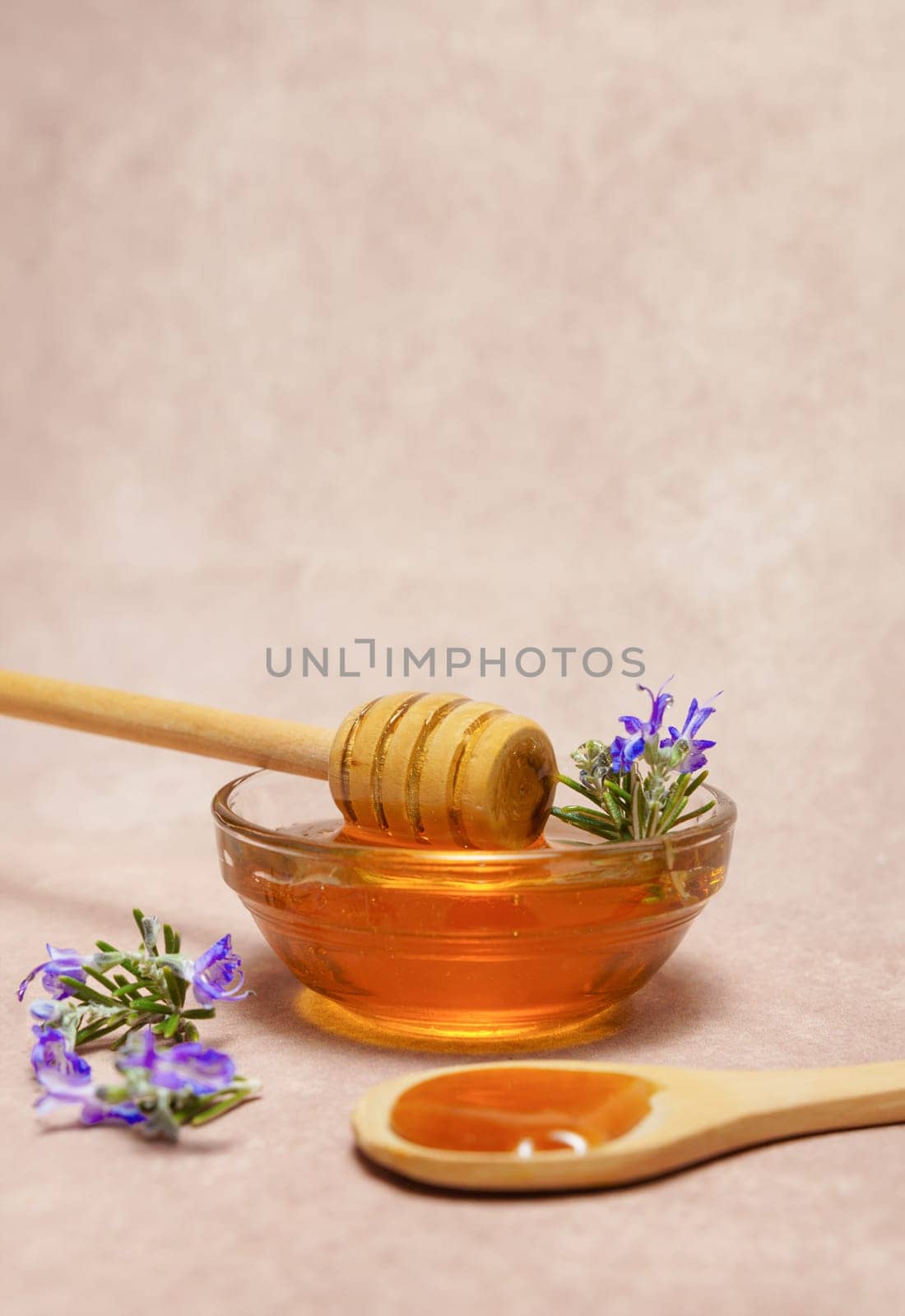 natural honey in a glass bowl by joseantona