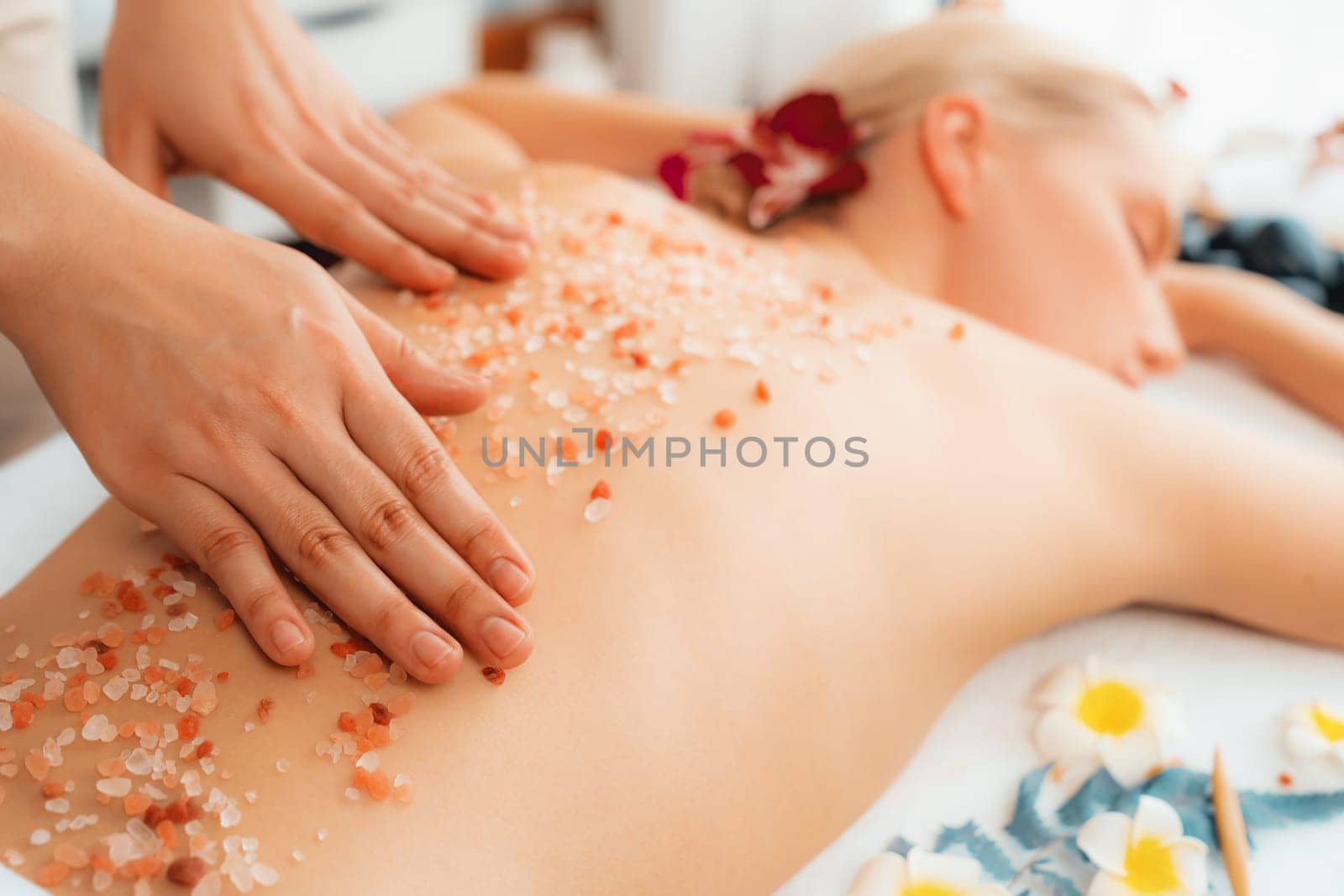 Closeup woman customer having exfoliation treatment in luxury spa. Quiescent by biancoblue