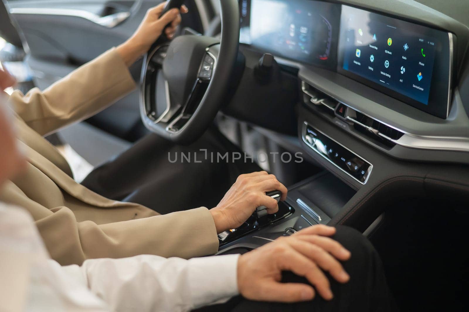 Close-up of the hands of an elderly Caucasian woman in a car