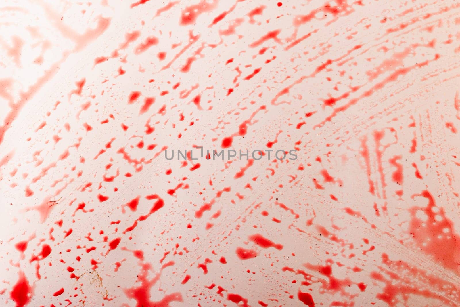 red currant juice on white background looks like a blood splashes.