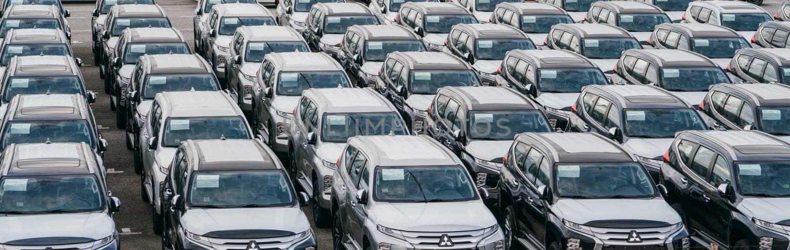 Lamchabang, Thailand - July 02, 2023 In a bustling factory garage, new cars are prepared for parking and transportationa reflection of modern automotive industry and technology.