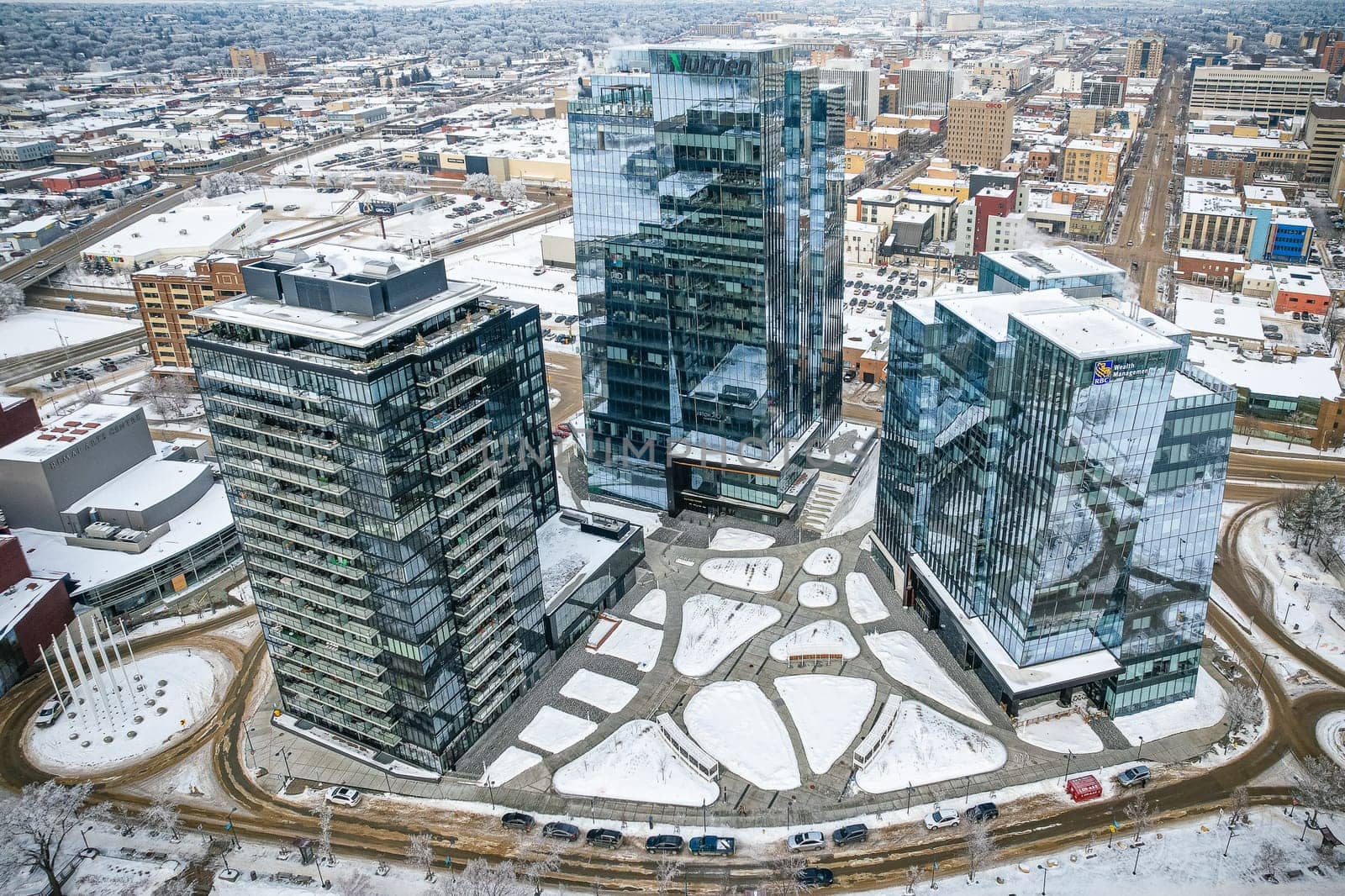 Aerial spectacle of downtown Saskatoon, revealing the city's architectural marvels, bustling streets, and the pulsating core of Saskatchewan's metropolis